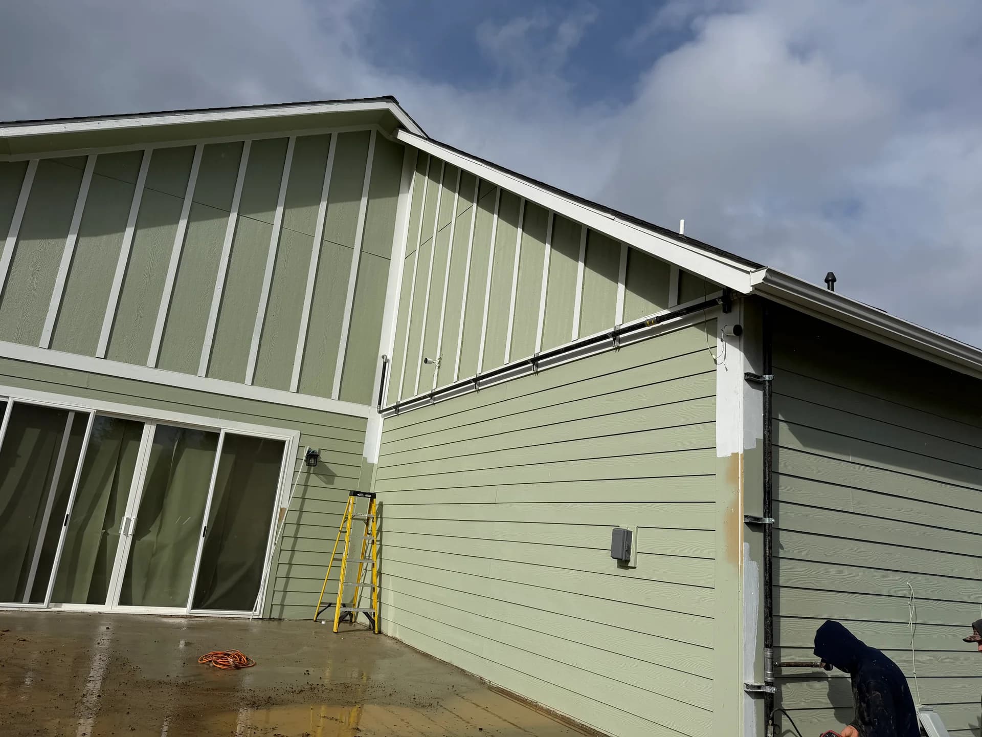 Gas and electrical line installation on exterior wall — commercial