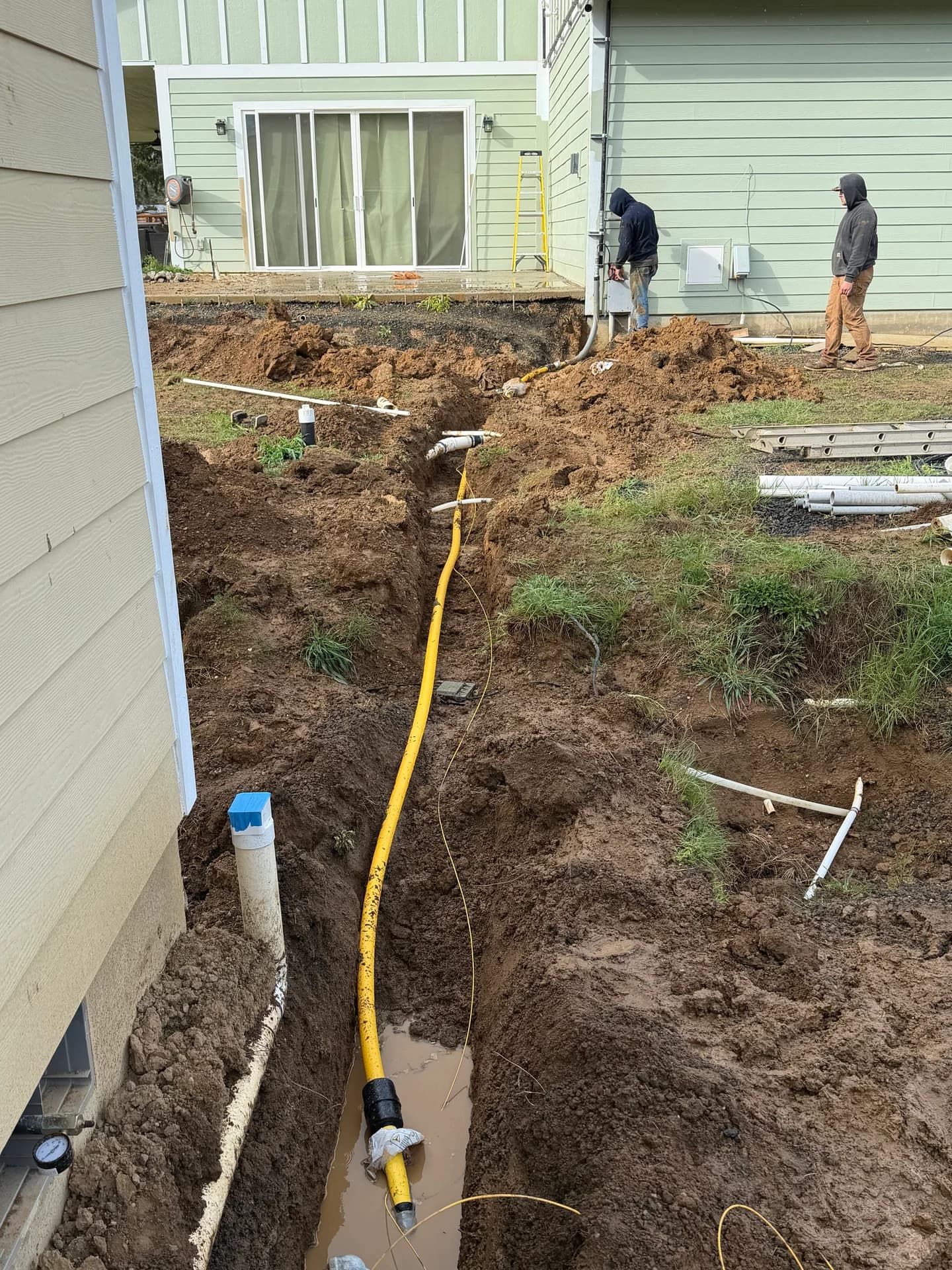Yellow CSST gas line in open excavation trench